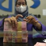Rupiah Pressured by Firmer Dollar, Domestic Caution